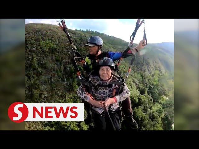 87-year-old daredevil creates buzz online for paragliding in Ranau