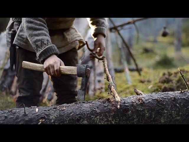 Bushcraft trip - natural shelter, drying meat, no sleeping bag, all night fire, homemade axe etc.