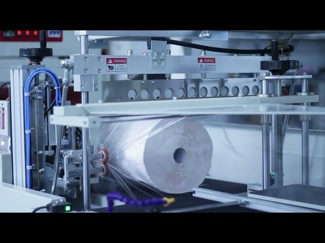 Stable speed labeling maxi roll paper towel heat shrink packing machine