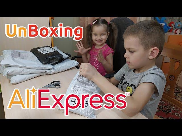 UnBoxing goods from Aliexpress: children's clothing, clothes for boys and girls, women's outfits