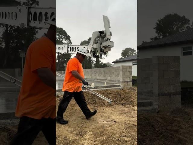 Laying cinderblock in a DOWNPOUR with robots