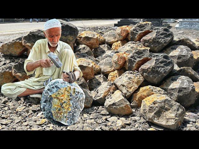 An 80-year-old man made a langi from granite mortar stone