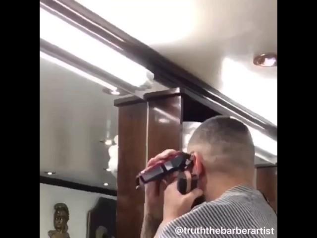 Truth the barber artist does haircut on himself