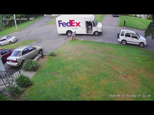 Fedex leaving package almost at street.