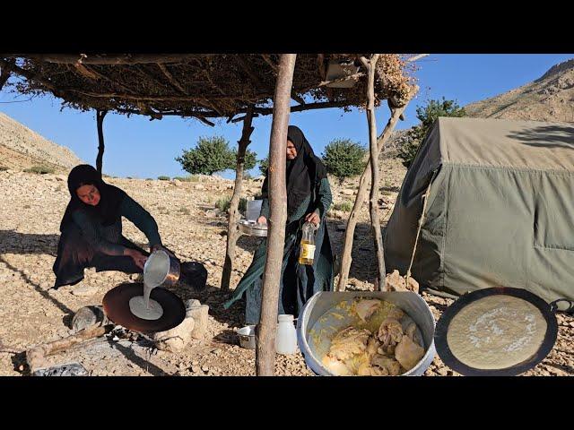 Nomadic life in Iran:Baking traditional local bread by an Iranian nomadic woman in heart of mountain