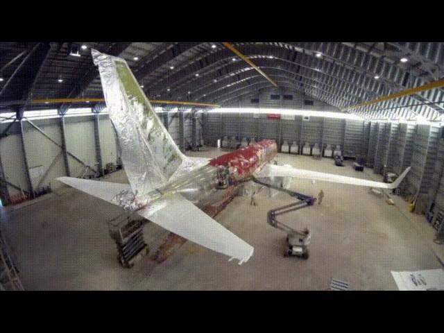 Removing the paint from an airplane