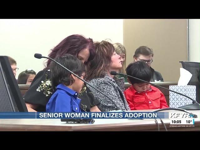 Senior woman begins new life with adopted sons