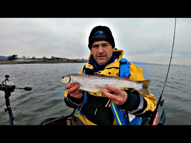 Trolling for Bass and Catching Sea Trout on a Kayak using Frozen Sand Eel for bait