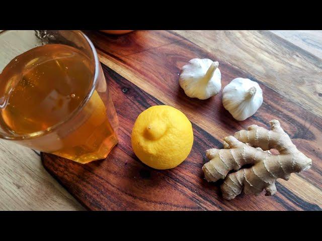 Homemade syrup for colds and strengthening immunity. Honey, lemon, ginger, and garlic.