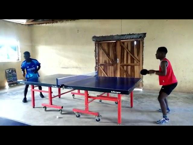 Charles Silungwe and Moses playing forehand