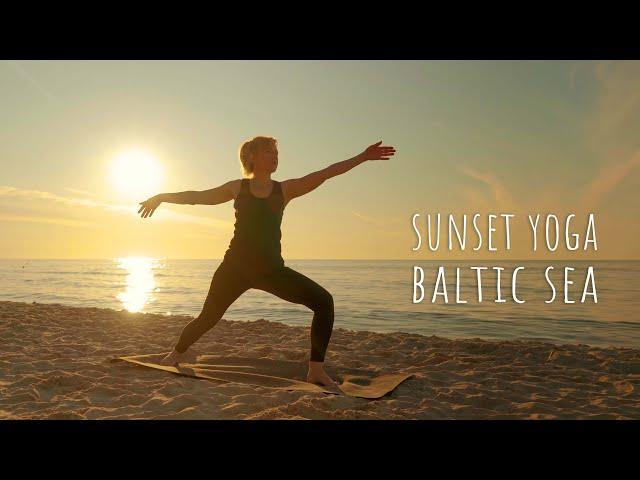 Beautiful woman practice medicine yoga in meditation pose on sea beach lotus position asana balance