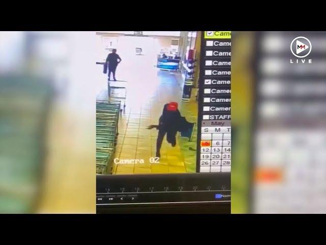 Security guard hailed as hero after shooting at armed robbers