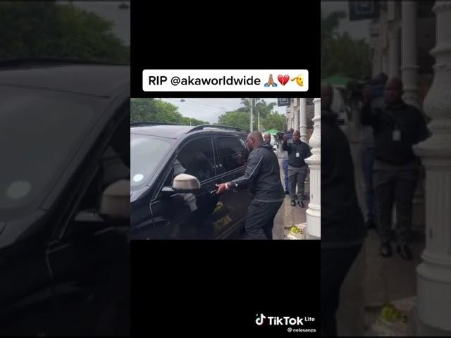 Rapper AKA's Father Takes flowers to where his son was shot from