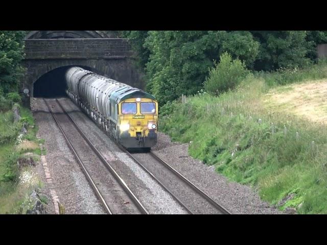 Planes, trains and...sheep. 66607 hauls empty cement wagons today