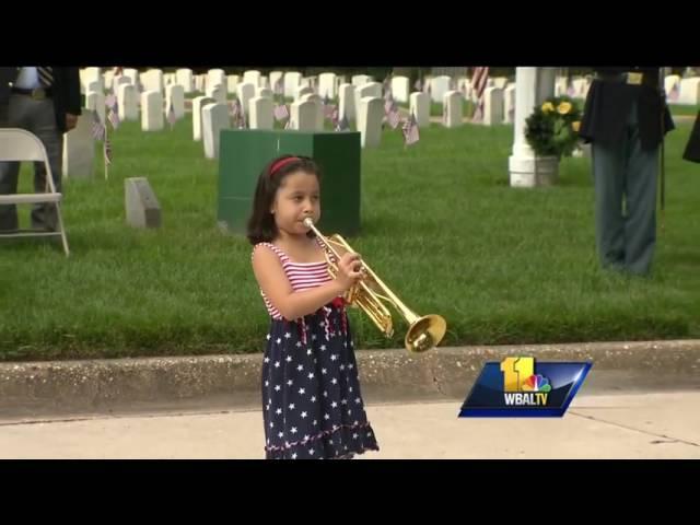 Girl plays Taps in tribute to fallen service members