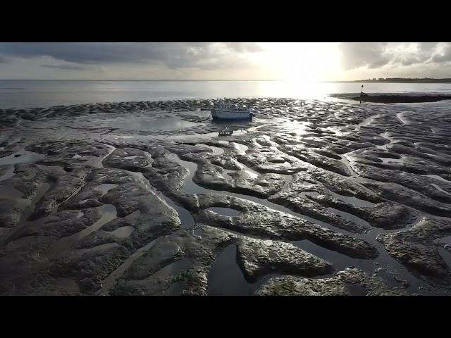 Point clear  st osyths  beach, featuring aviation museum , by drone footage uk