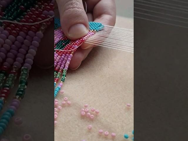 One loom row of a fringe beaded necklace. Full tutorial is already on the channel!