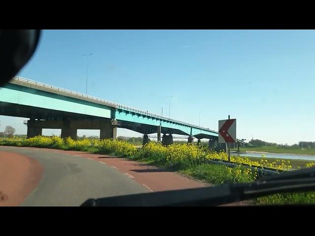 Relaxing car ride through the Dutch landscape green fields and dikes unwind