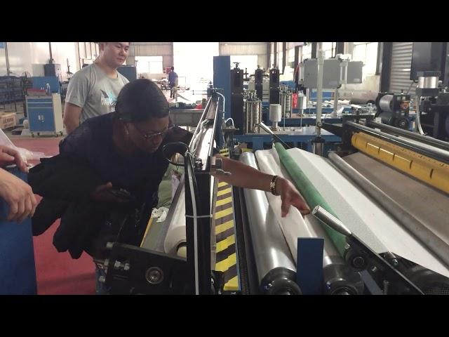 Semi automatic toilet paper rewinding machine with embossing and auto cutting ( low cost)