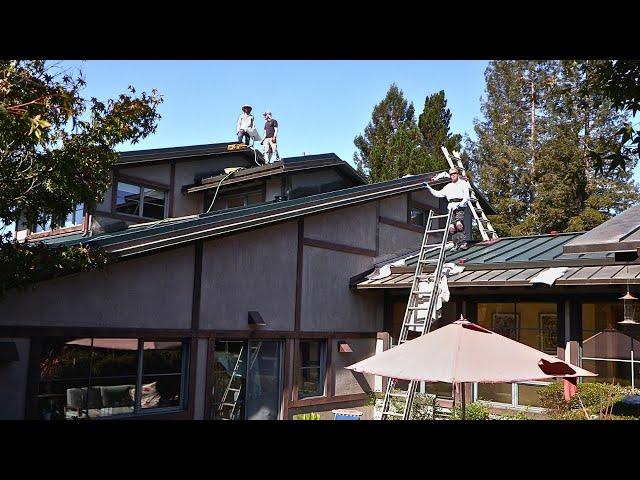 Stucco repairs after new metal roofs installed