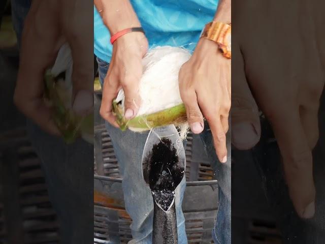 Opening coconuts by hand all day is hard work Thailand Coconut open