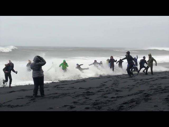 Waves Sneak Up Reynisfjara Beach in Iceland and Knock Over Tourists