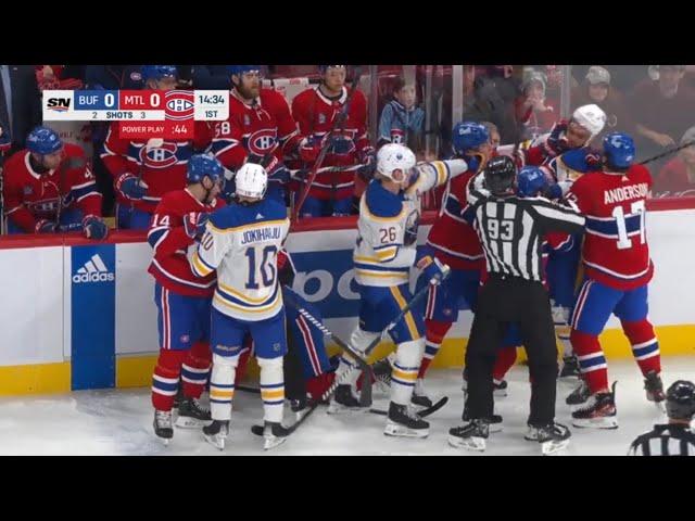 Mike Matheson staples Zach Benson causing scrum