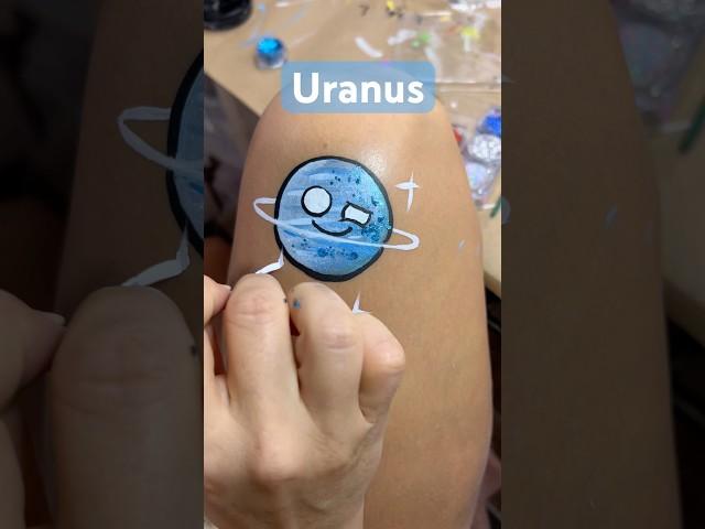 Heres a painting of Uranus from Solarballs #uranus #solarballs #facepaint #facepainting