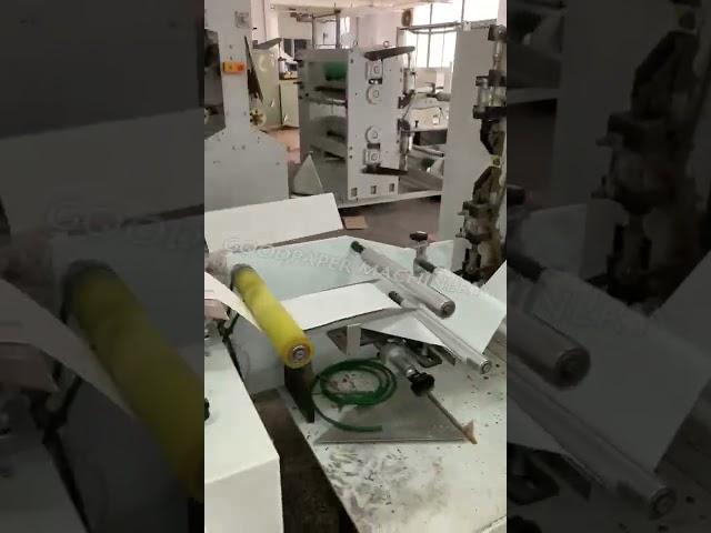 Napkin tissue folding machine with glue lamination and color units