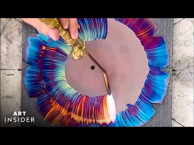 Artist Torches Colorful Designs On Copper Clocks