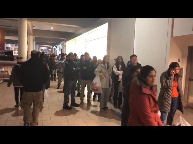 See line of shoppers waiting for Best Buy to open at Destiny USA