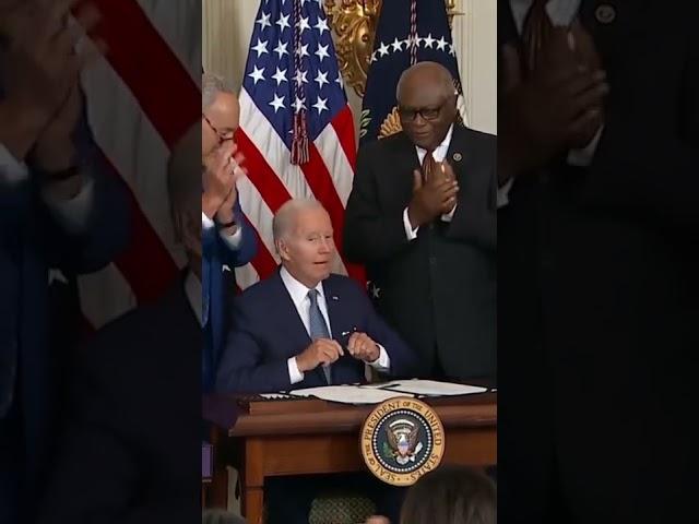 #Biden Signs Inflation Reduction Act, Gives Manchin Pen