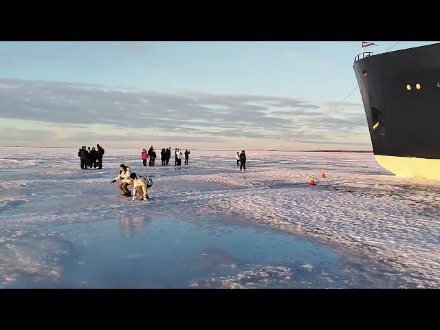 Walking on ice at the bay of Bothnia in northern Finland 