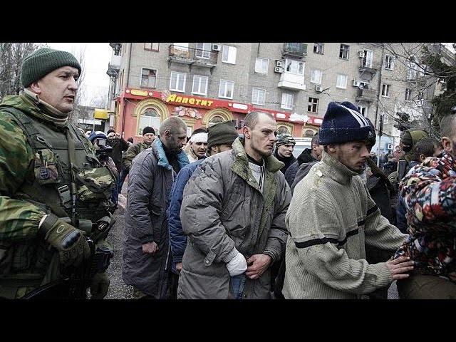 Captured Ukraine soldiers face angry crowd at scene of bus shelling, Donetsk