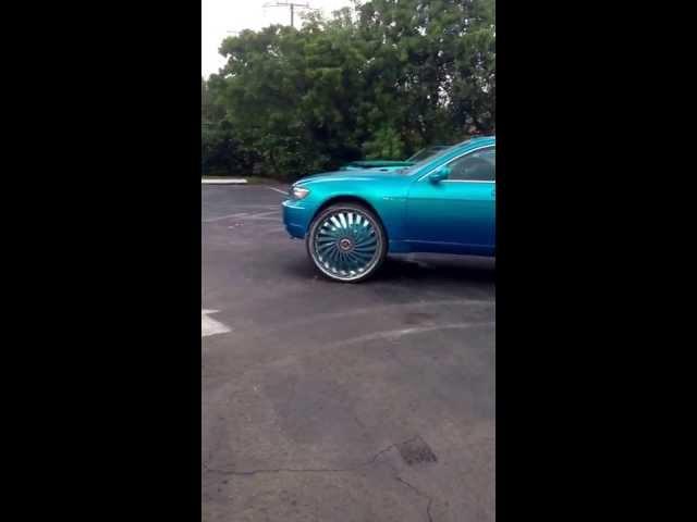 Kandy teal BMW 750 on 30s DUB SWYRLS