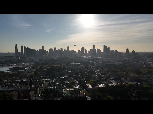 Smoky Wednesday morning drone flight video over Glebe Sydney Australia CBD bridge tower sunny smokey