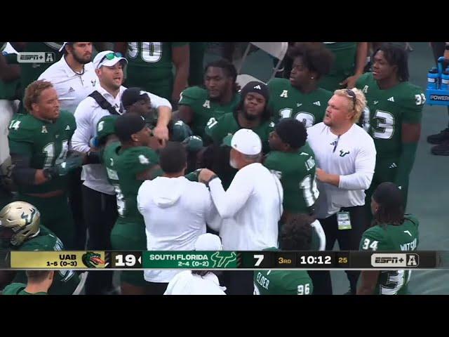 USF players fight each other on the sideline 