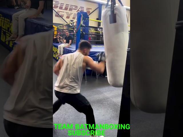 ARTEM OGANESYAN WORKING ON THE HEAVYBAG SHOWING FAST HANDS LETTING SHOTS GO
