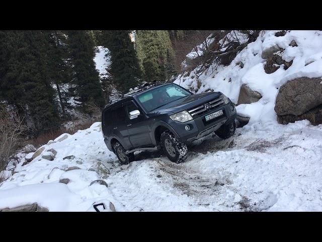 Pajero 4 on snow rocks