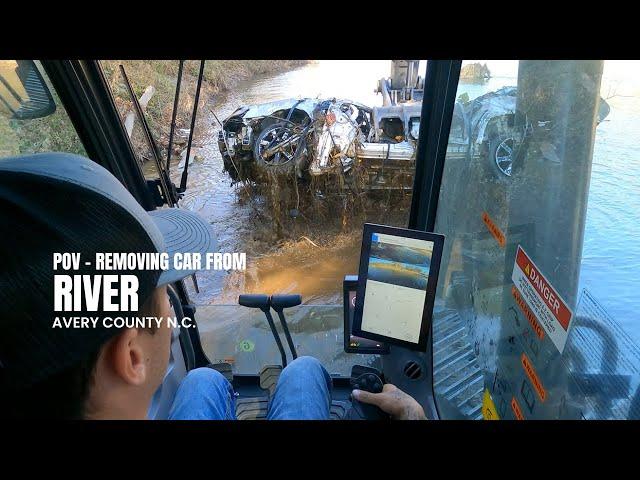 POV - pulling a car out of the river in N.C. after the Hurricane