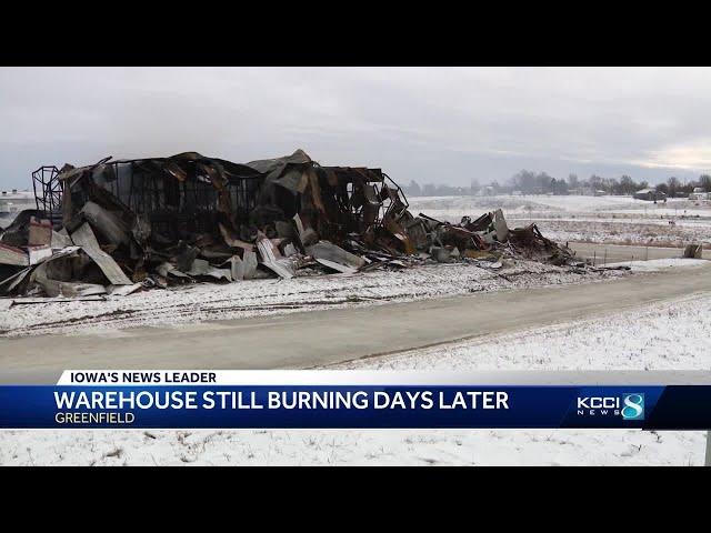 Fire at Greenfield trucking company continues to smolder