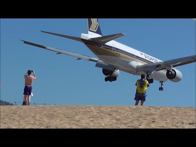 Planes over beach landing at Phuket Airport.