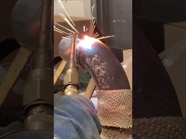 Torch welding exhaust pipe
