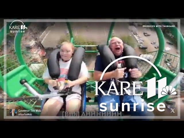 Gov. Tim Walz and his daughter try the Slingshot at the Minnesota State Fair