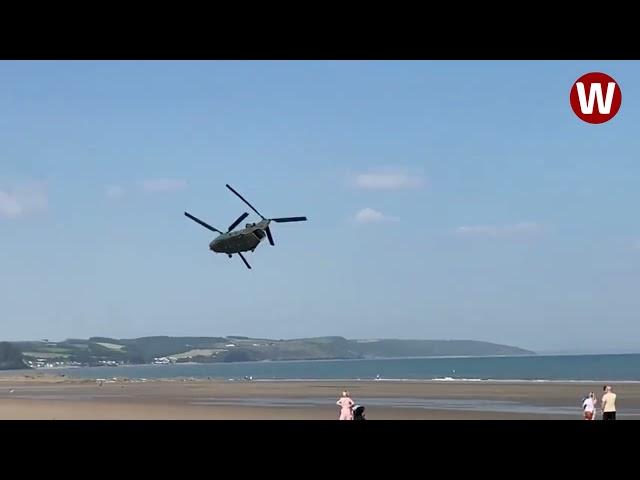 Moment low-flying Chinook helicopter thunders over Welsh beach