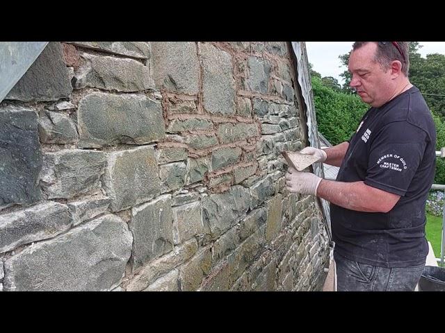 Re pointing using a pointers hod on an un even stone wall with lime mortar tips for beginners