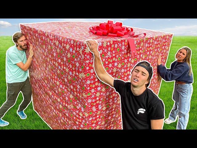 Last To Take Hand Off GIANT Christmas Present Wins!