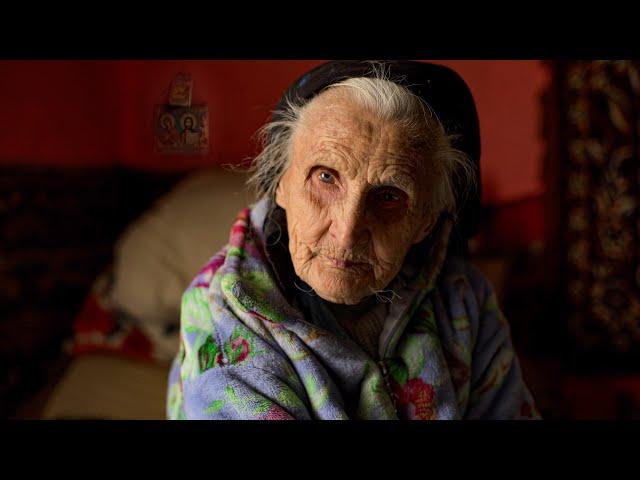 Difficult old age of a 96 year old grandmother with her son in a high mountain village