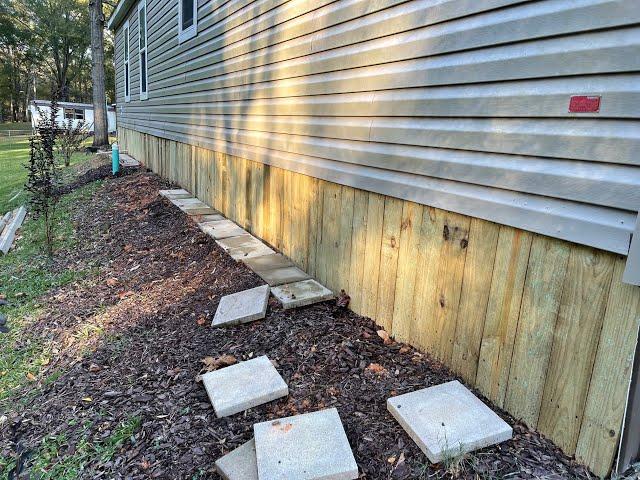 Mobile home skirting using treated lumber