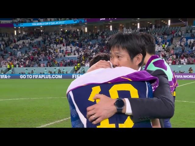 Japan manager Hajime Moriyasu consoles an emotional Hiroki Sakai after Japan's knockout stage exit